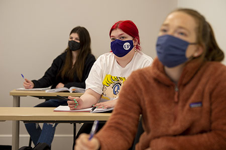 Three students in classroom