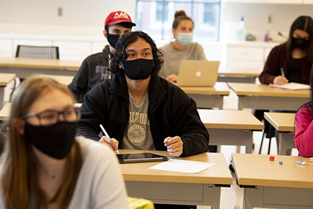 Student at desk in classroom