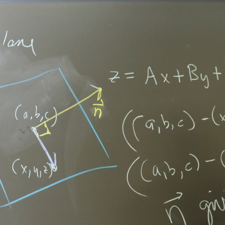 mathematical equations on chalkboard.