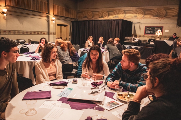 students conversing at table