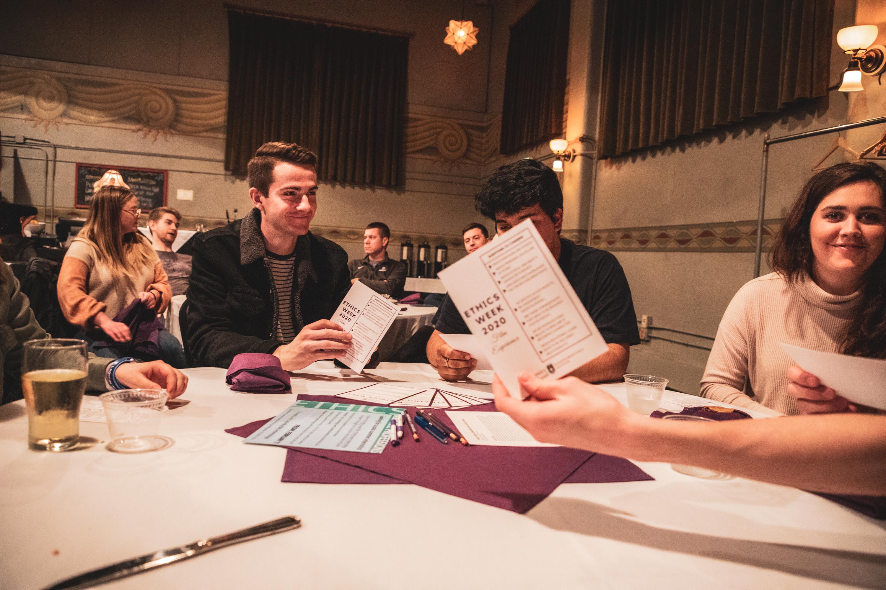 students discussing Ethics Week 2020 Film Experience questions at table