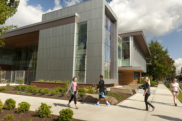 Student walking in front of Beauchamp Recreation and Wellness Center