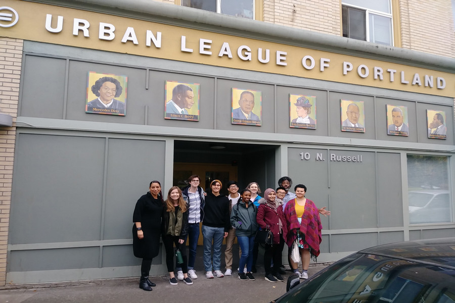 A volunteer group poses for a photo outside the Urban League of Portland