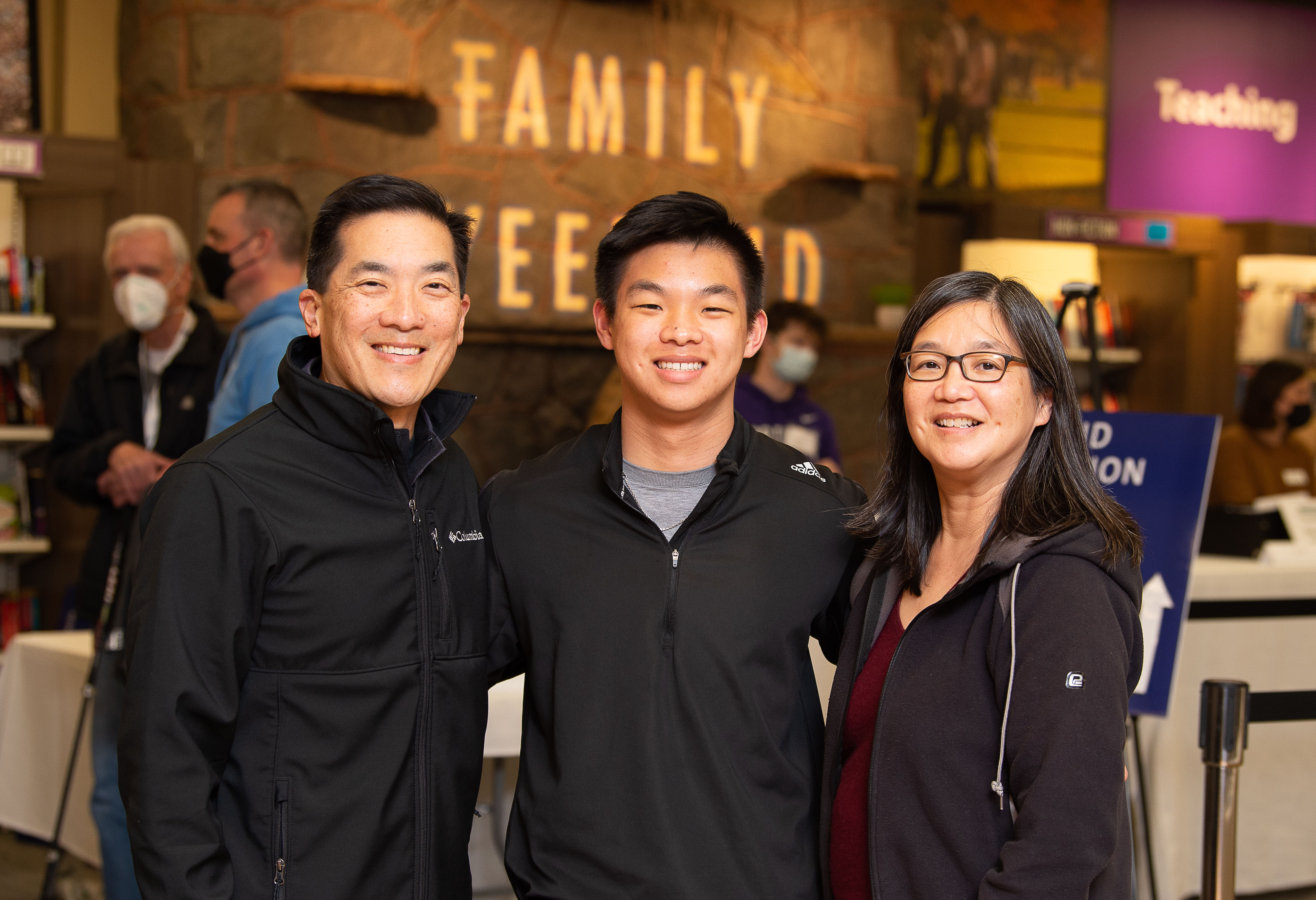 Family and friends with arms around each other.