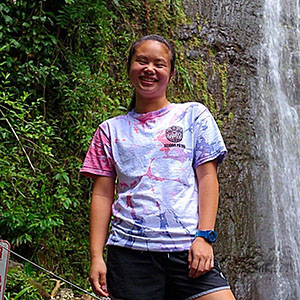 Michelle Lau in front of a waterfall