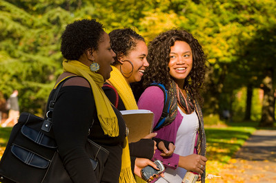 three students talking and laughing