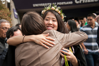 student hugging parent at graduation