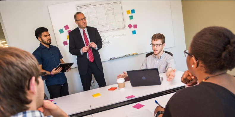 professor and students talking.