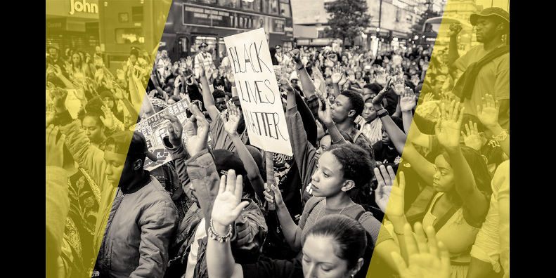 peaceful demonstrators with Black Lives Matter sign