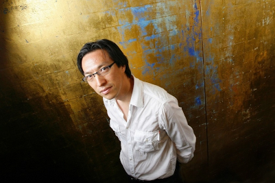 Makoto Fujimura in front of his artwork