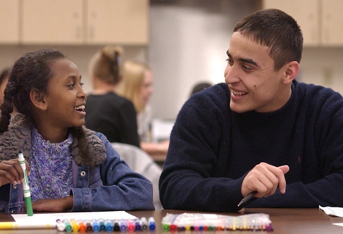 teacher with student coloring