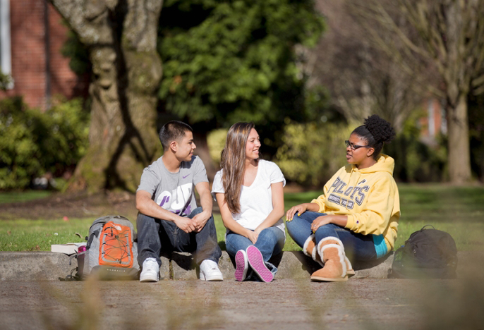 Three students talking