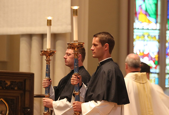 Holy Cross seminarians assisting at Mass