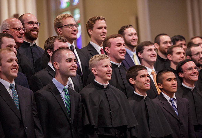Holy Cross seminarians taking vows