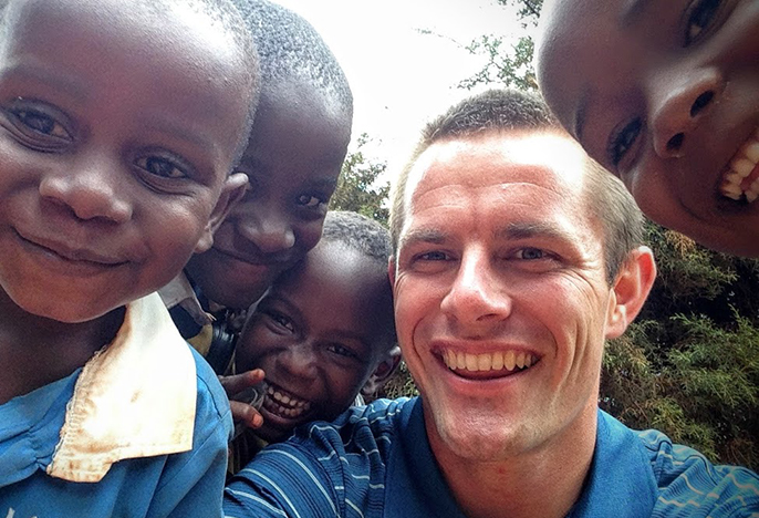 Brogan Ryan with kids in eastern Africa