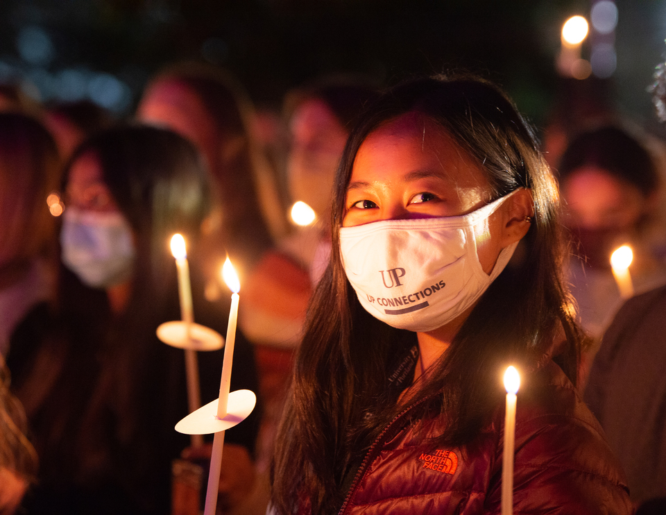 Friends gather to light candles and mark the beginning of a new school year at the Bell Tower Ceremony.