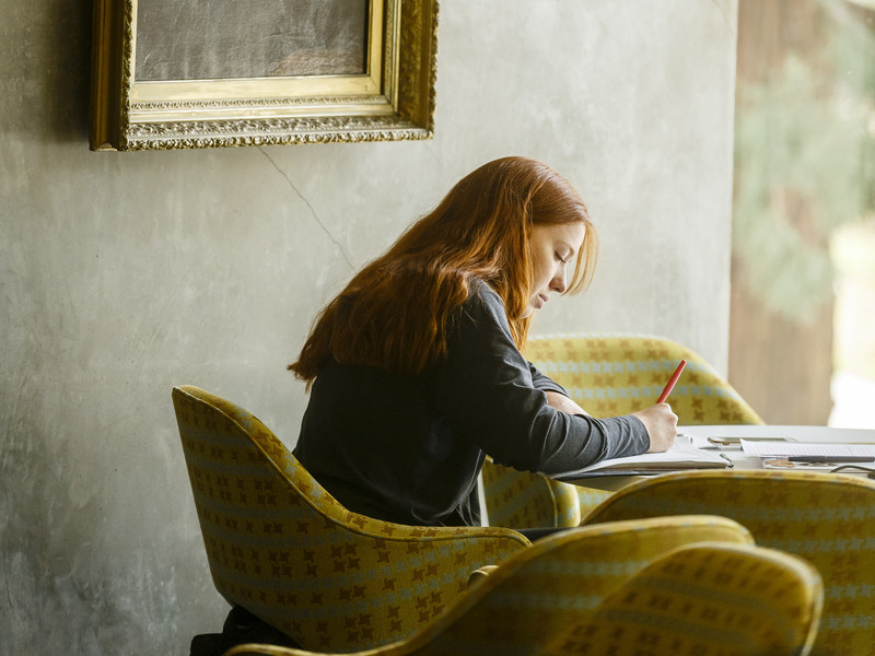 Student studying under painting