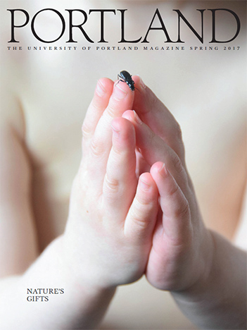 child's hands holding a bug by Kelly DuFort '00