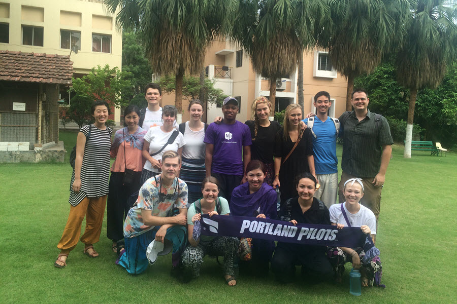 group shot of students in front of hotel during India Immersion