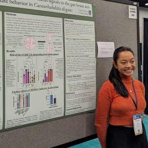 Angel Dulay with research poster