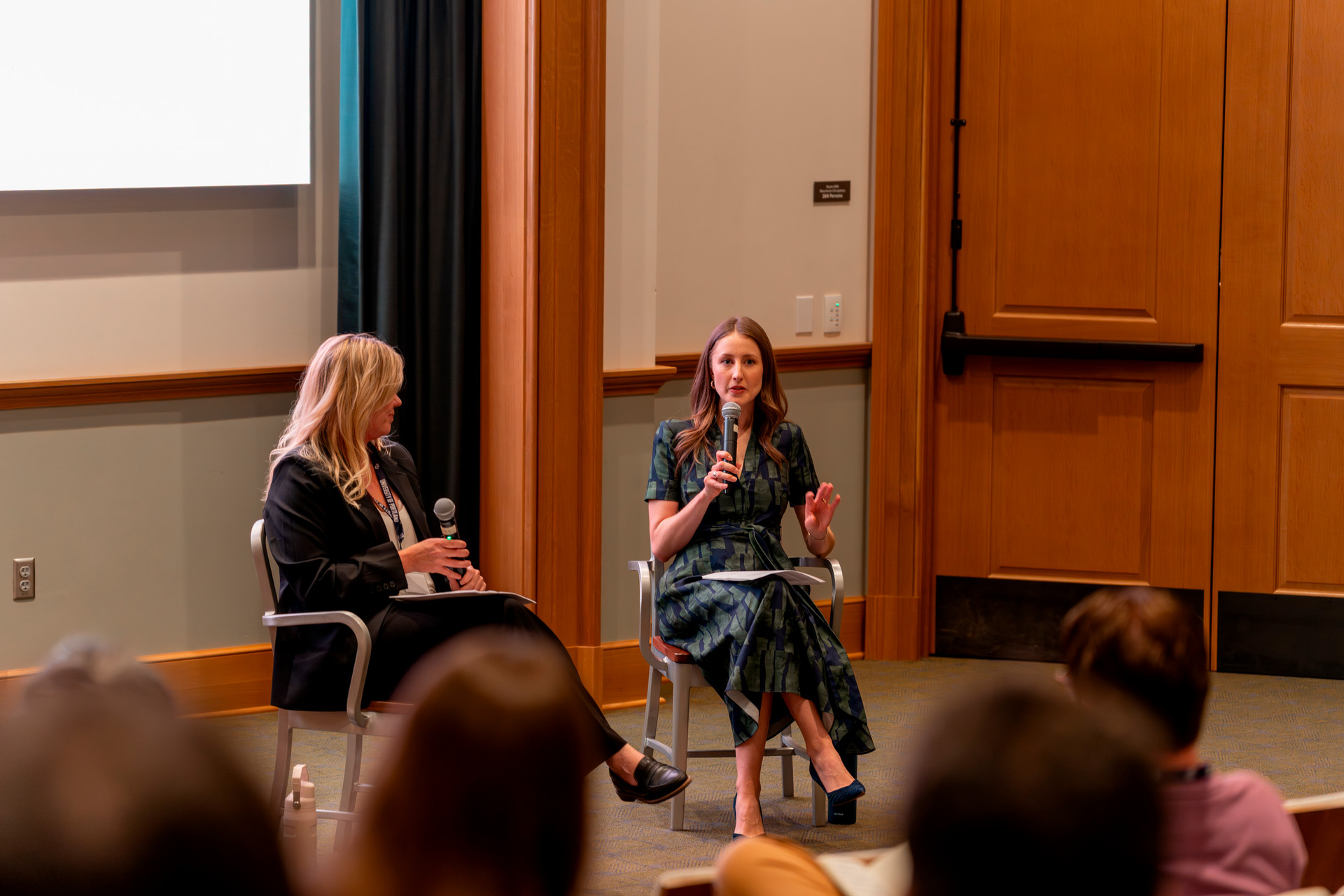 Clare Duffy and Natalie Nelson-Marsh on the stage at the AI and Catholic Education Conference at UP.