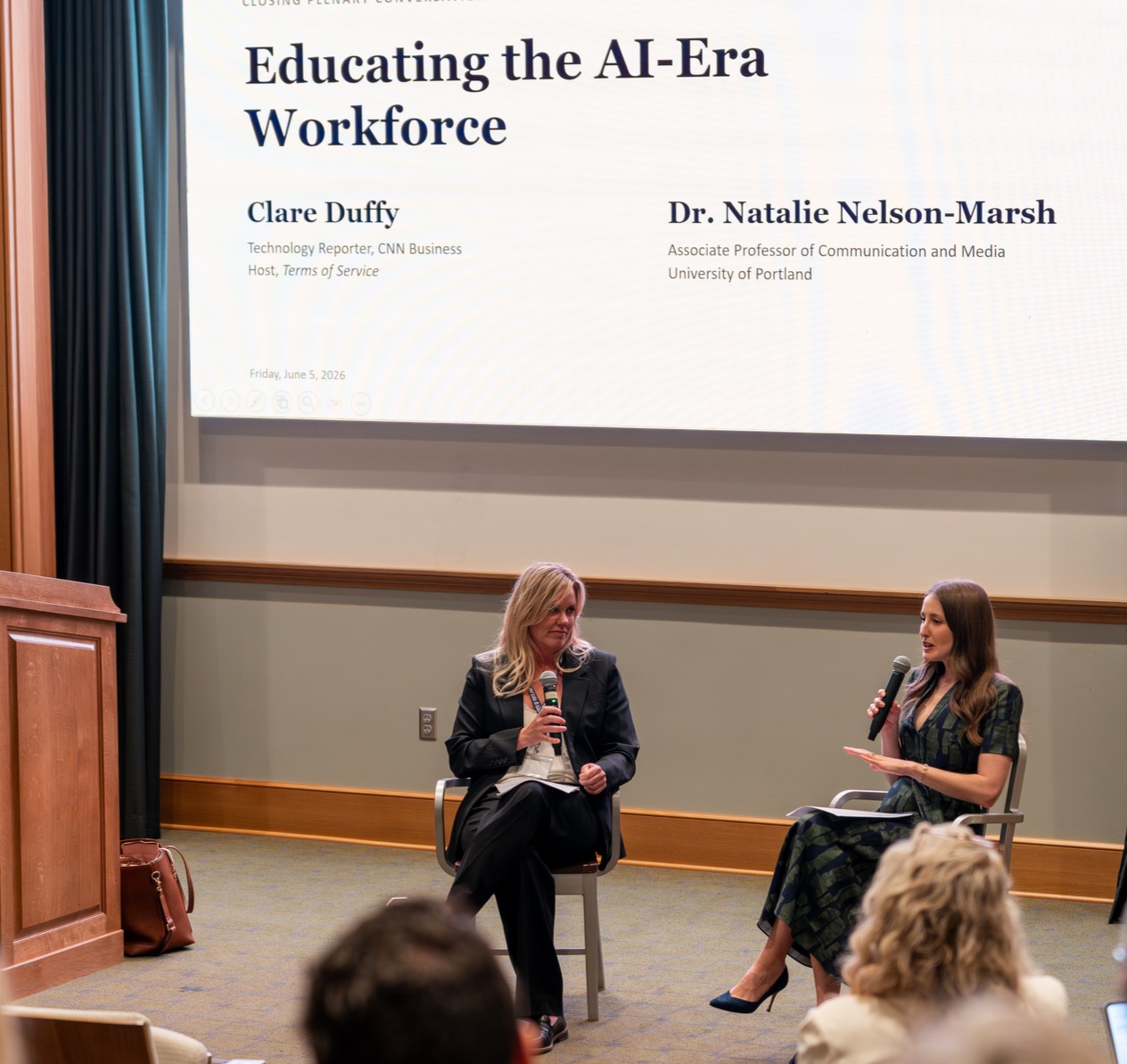 clare duffy and natalie nelson-marsh at the ai conference on stage