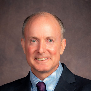 new dean john smiling
