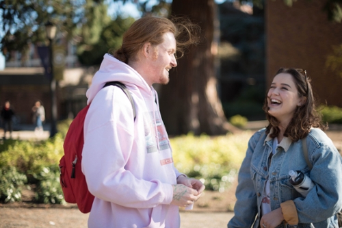 girl and boy laughing