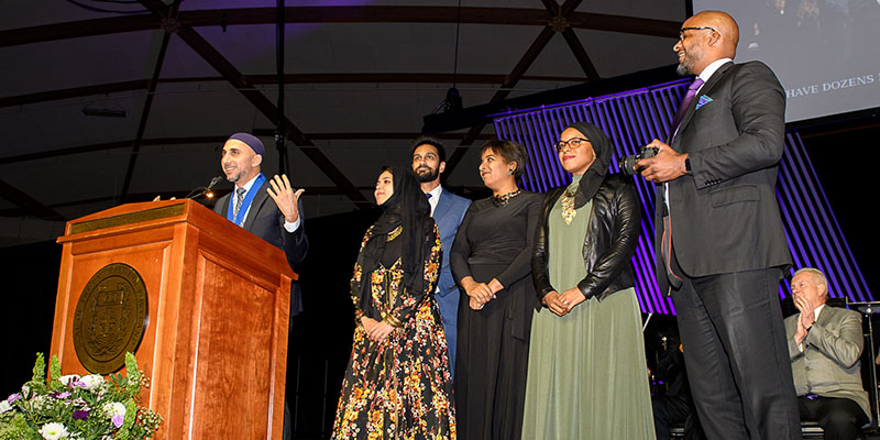 Group at podium speaking