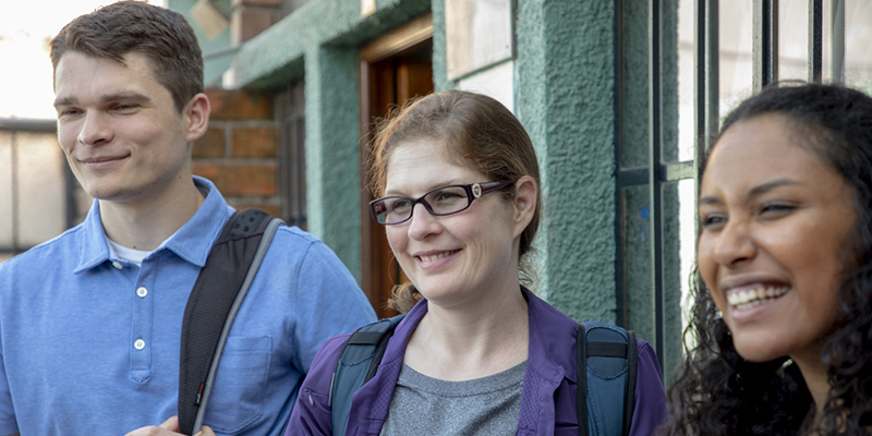 photo of three people standing together