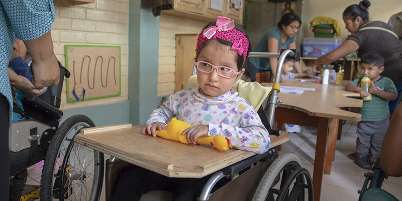 photo of young girl in wheelchair