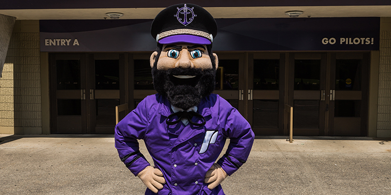 Wally Pilot in front of the Chiles Center