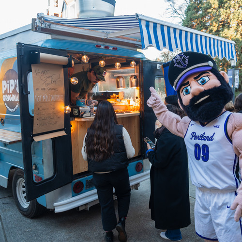 Wally Pilot points to a donut food cart