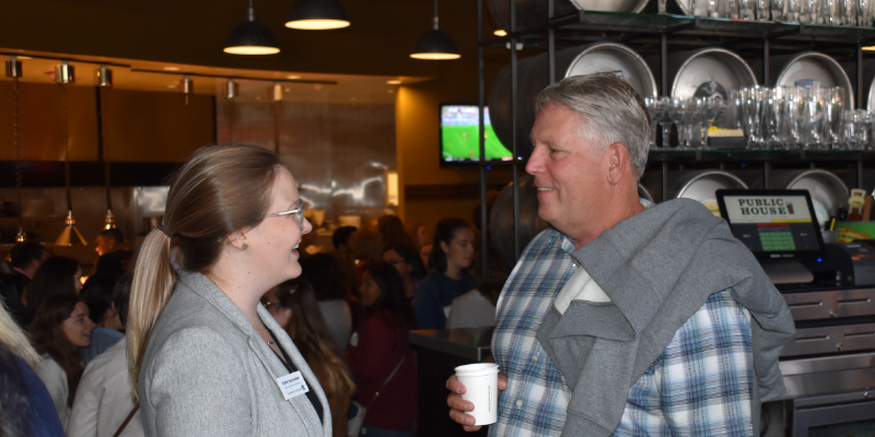 Katie Seccombe talking with parent