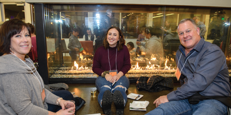 photo of family by fireplace in commons