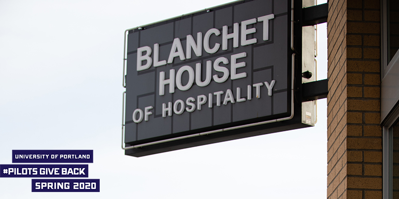 Blanchet House sign with logo that reads University of Portland Pilots GIve Back Spring 2020