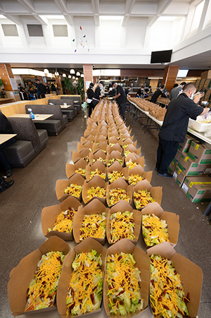 Boxes of salad on table