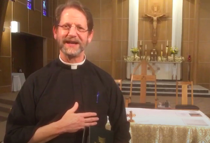 Fr. John Kerns in front of altar