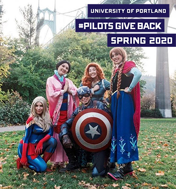 Students dressed like characters outside with logo that reads University of Portland Pilots Give Back Spring 2020