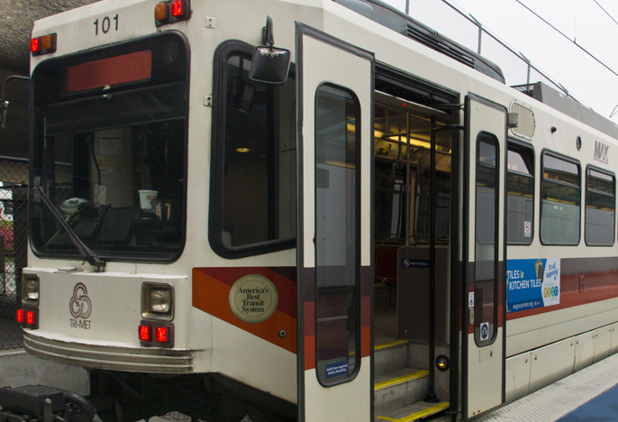 MAX light rail car stopped with doors open.