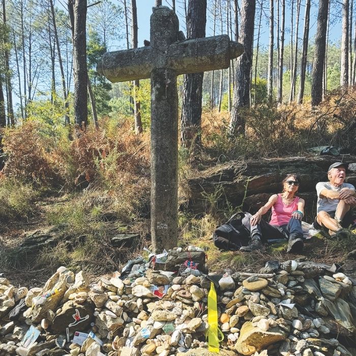 pilgrims rest by a cross