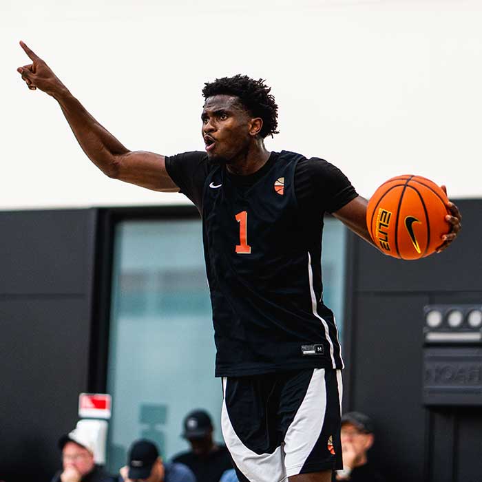 a basketball player dribbles the ball