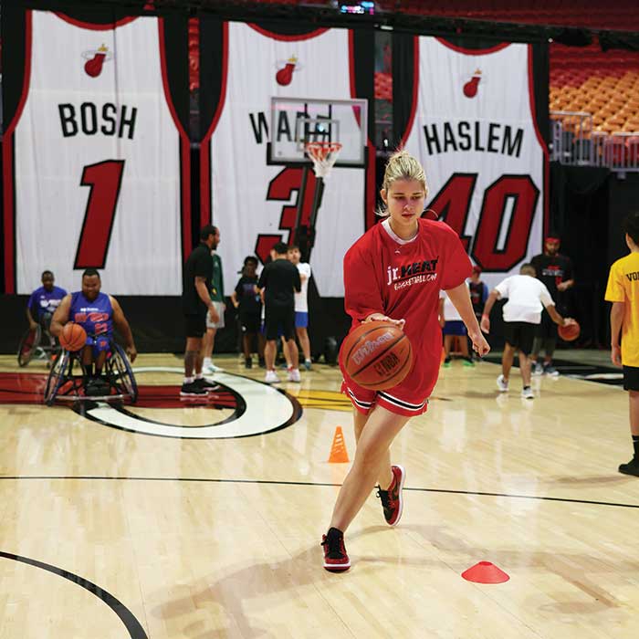 Sophie Flicker dribbles a basketball