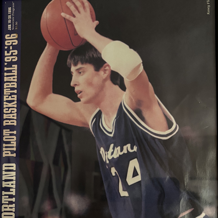 Kasey Flicker holds a basketball above his head
