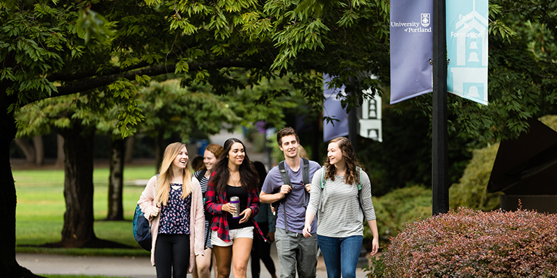 students walking outside on University of Portland campus