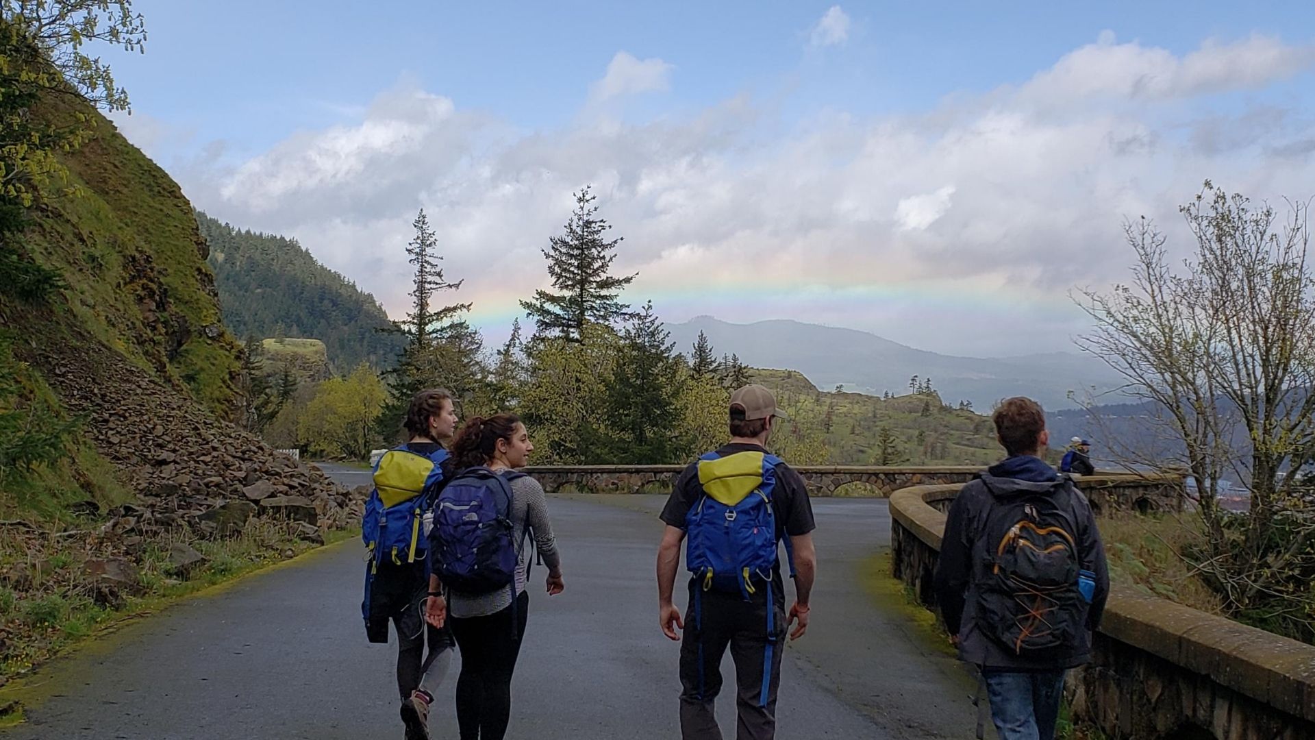 hikers seeing a rainbow 