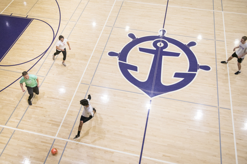 students playing on the basketball courts