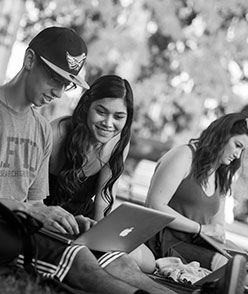 students with laptop