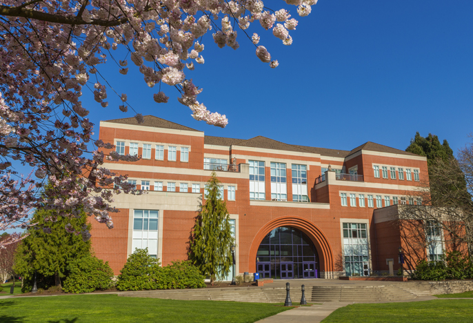 Franz hall and part of quad with cherry blossoms.