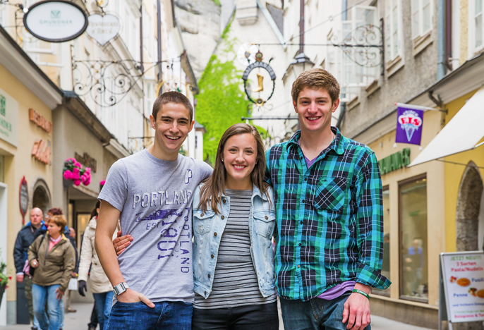 Three students smiling